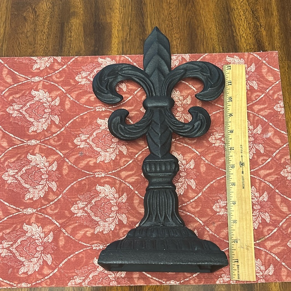 Cast iron fleur-de-lis.